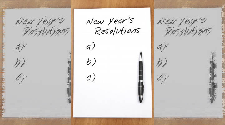 New Year's Resolutions written across the top of a piece of paper with a pen.