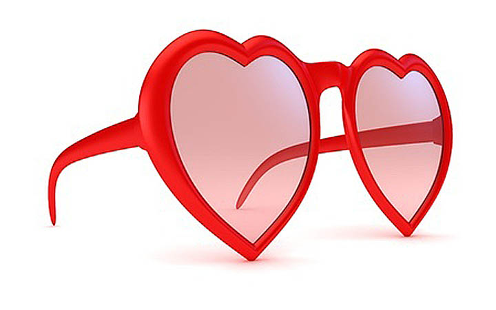 A pair of heart-shaped rose-colored sunglasses indicating falling in love too fast.