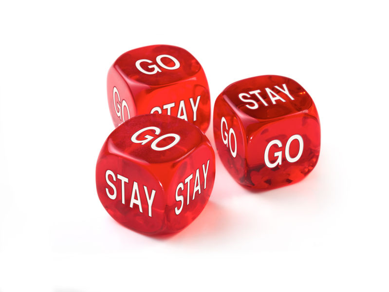 Dice depicting the question of should I stay or should I go?