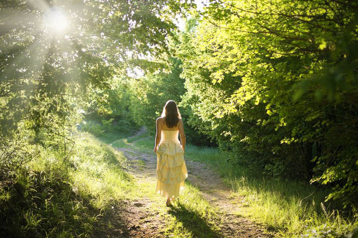 A beautiful woman walks down a path, representing different choices in her relationships.