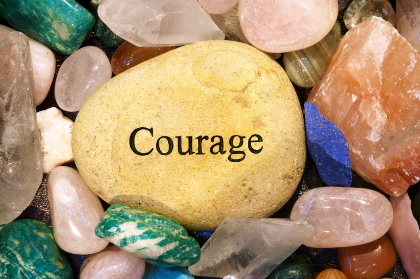 Beautiful rocks with the word courage written on one.