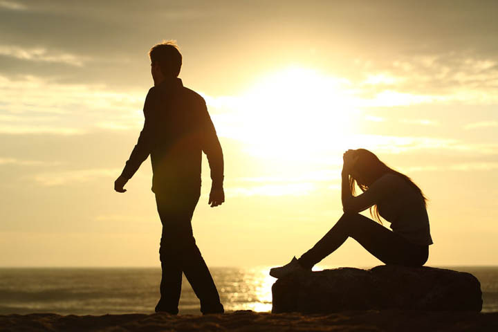 A man walks away from a woman after break up.