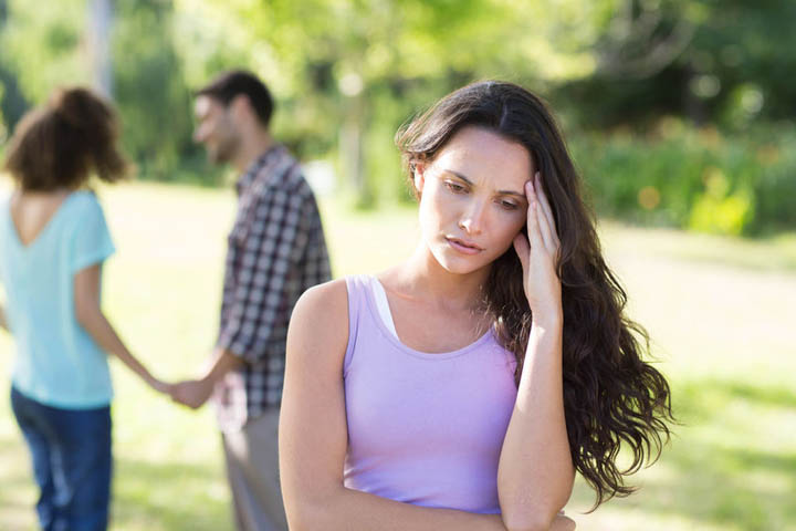 Woman upset at her crush with other girl on a sunny day