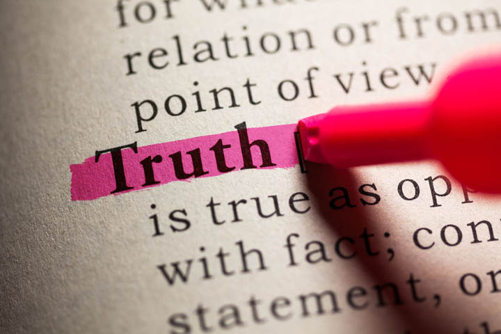 The word truth in a dictionary being highlighted with a red highlighter.