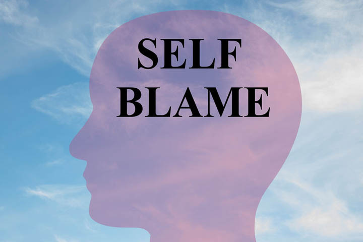 Self Blame written on silhouette of a person's head.