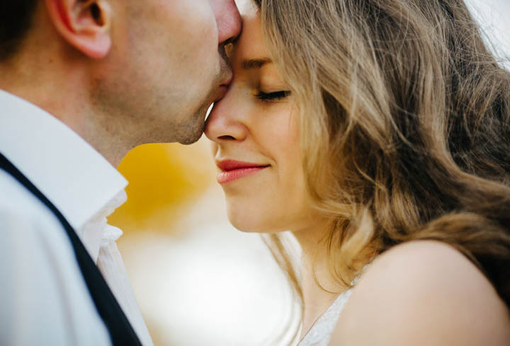 A couple enjoying embrace of each other and tenderly smiling