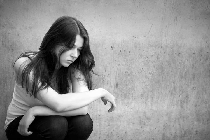 Outdoor portrait of a sad woman feeling rejected.