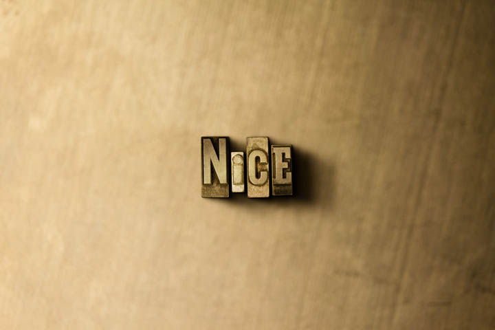 The word nice carved in wood.