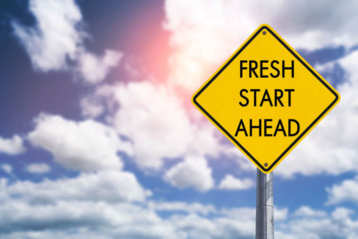 Fresh start ahead road sign concept for new year symbolizing making positive changes.