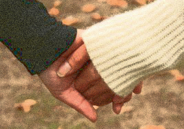 man and woman holding hands symbolizing commitment