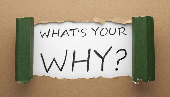 The words what's your why written on white paper.